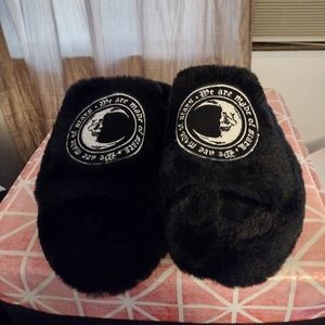 Black fuzzy slippers
